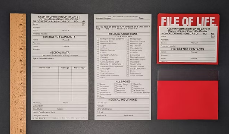 A photo of the file of life on a refrigerator next to a ruler to show that it takes up less than 6in