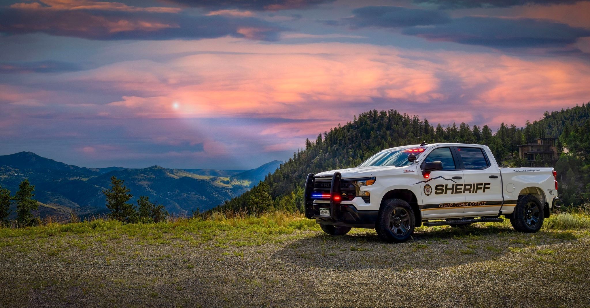 A CCSO truck on a sunny day in front of a mountain.